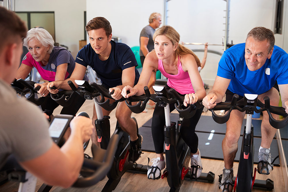 group exercise class using exercise bikes